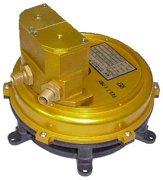 A yellow and black gas meter with a valve